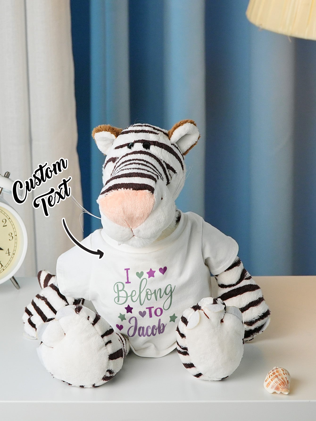 Personalised plush beside baby blanket to illustrate scale and nursery styling — birth announcement keepsake idea