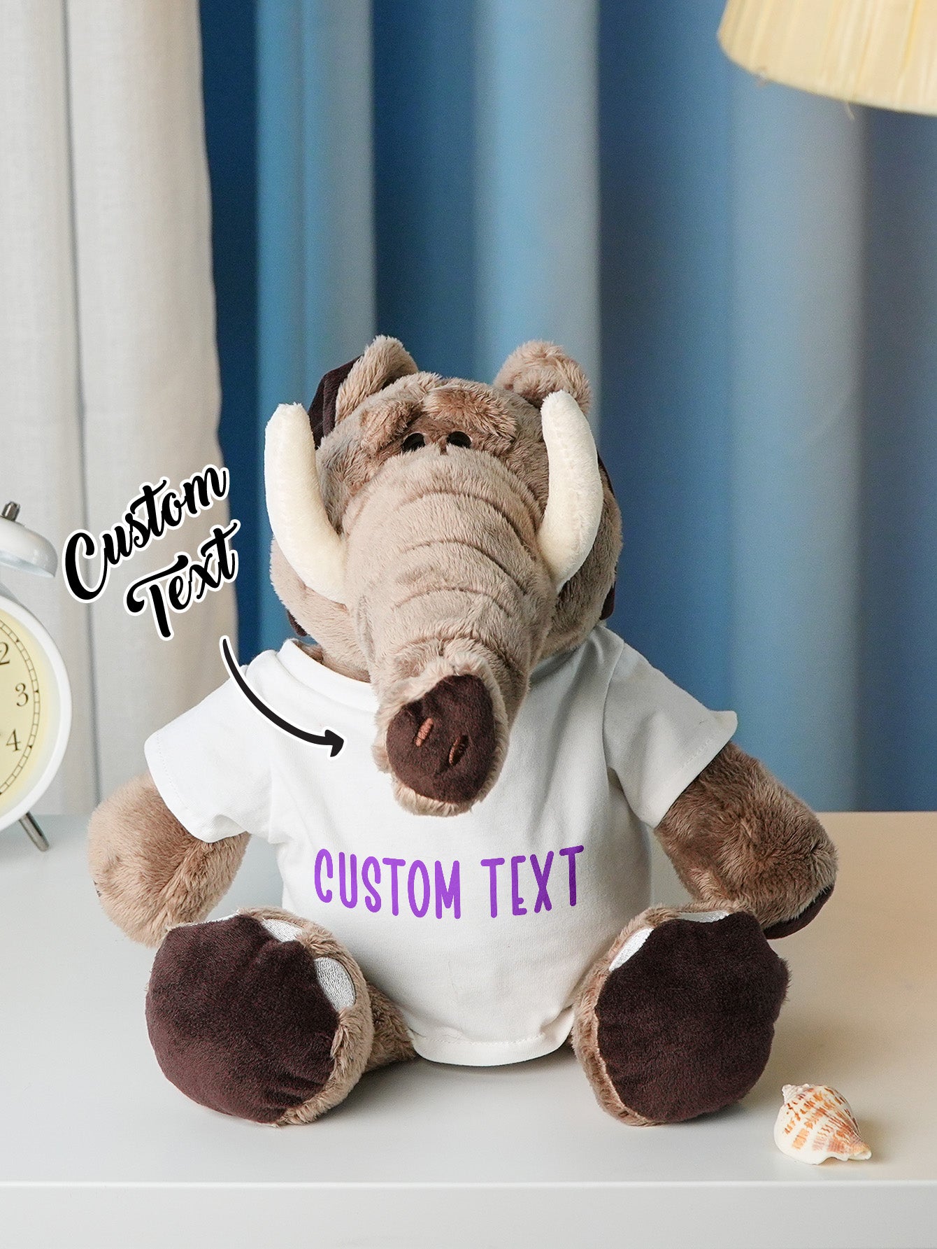 Personalised plush displayed with a newborn hat to show scale and suitability as a new baby keepsake