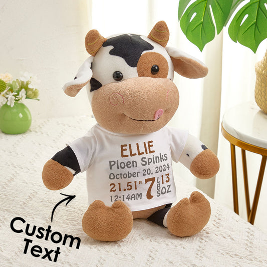 Personalised cow plush toy — front view with custom baby name and birthdate embroidered, ideal birth announcement gift for newborns
