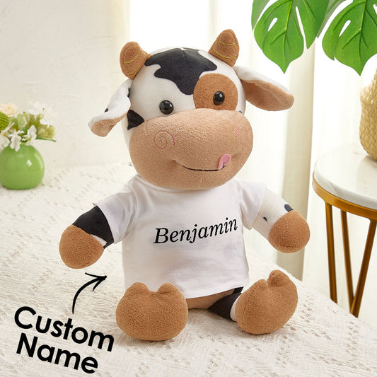Personalised cow plush toy with custom name on belly, soft huggable newborn keepsake for baby showers and first birthdays