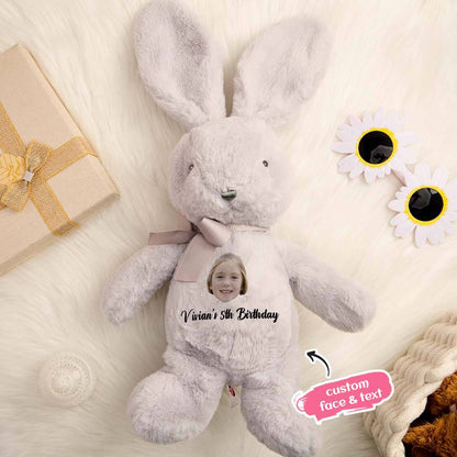 Small personalised bunny plush beside a pacifier for size reference — ideal newborn keepsake