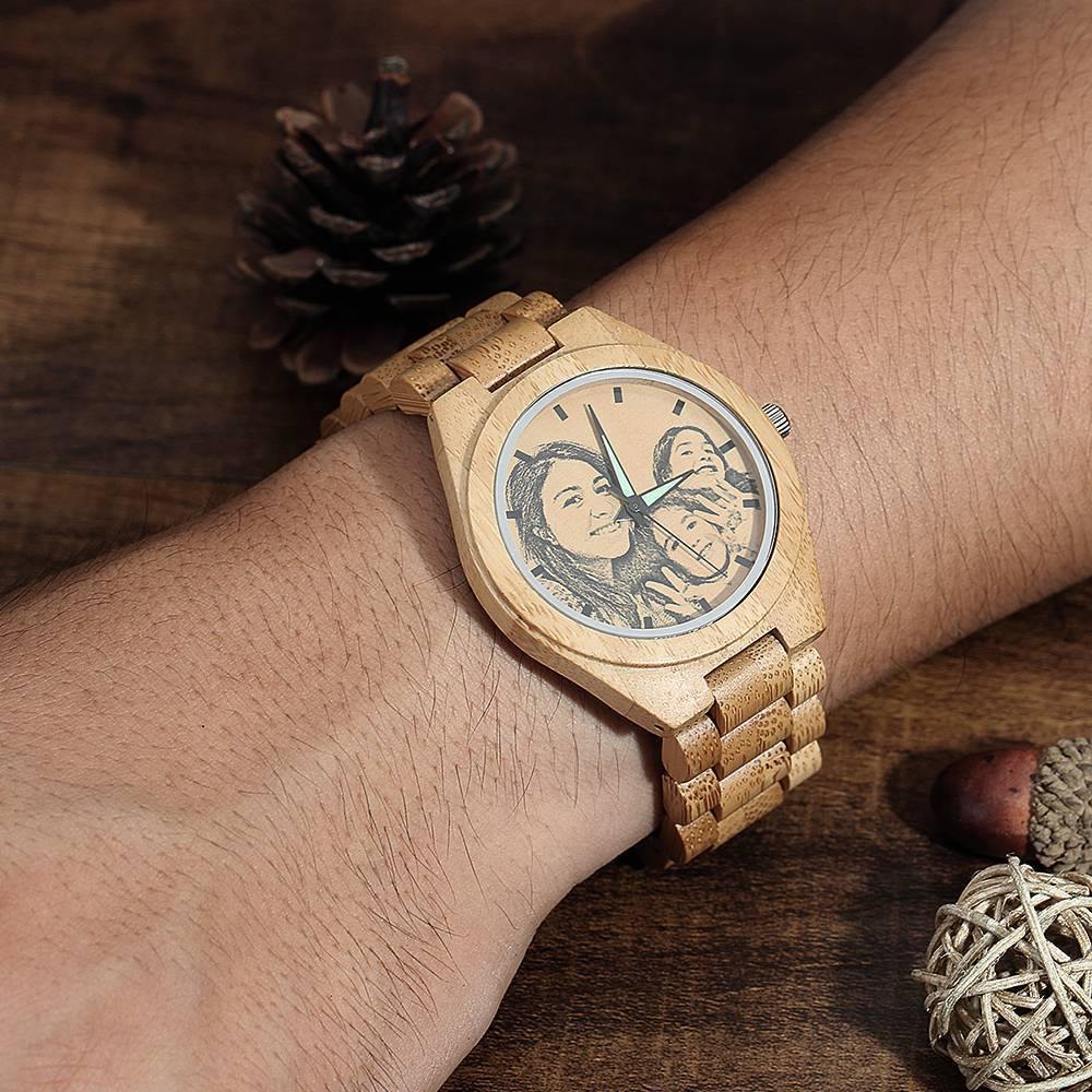 Lifestyle shot of a personalised engraved wooden men's photo watch 45mm worn on the wrist to show scale and style