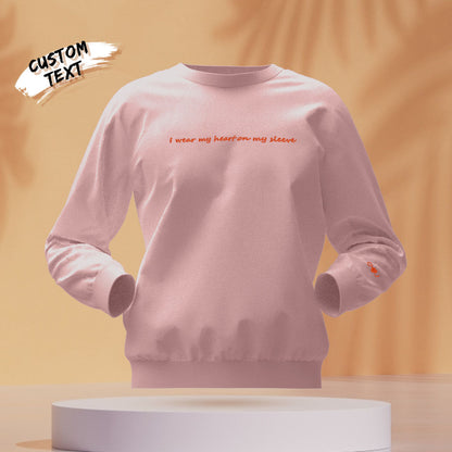 Detailed shot of embroidered custom text on personalised hoodie – add a name or quote for a unique engraved gift