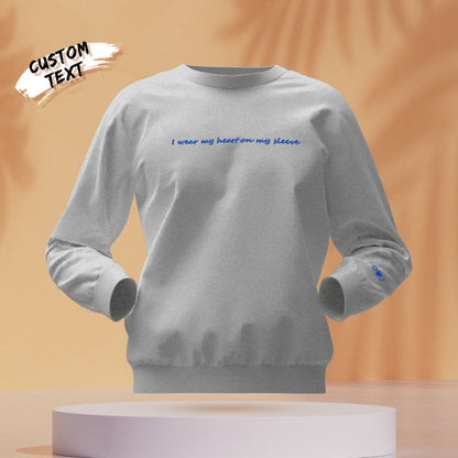 Woman wearing embroidered 'Heart On My Sleeve' hoodie personalised with a name – perfect engraved gifts for her or wife