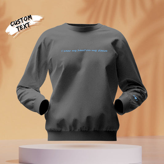 Front view of round-neck personalised hoodie with 'Heart On My Sleeve' embroidered design – personalised engraved gift for her