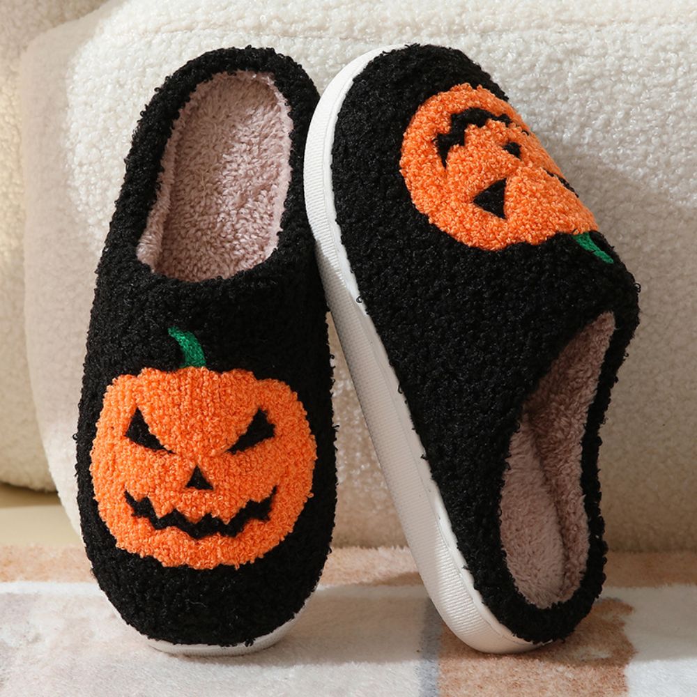Underside view showing TPR anti-slip sole of Halloween pumpkin slippers, durable grip for smooth floors and indoor use