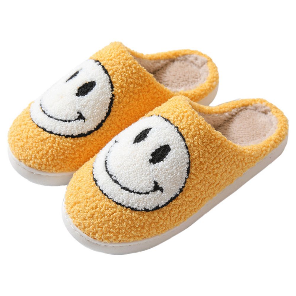 Interior view showing cushioned sponge insole and cosy cotton lining of Smiley Face fuzzy slippers for supportive comfort