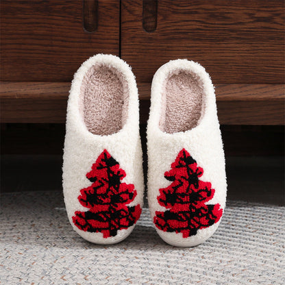Red Christmas tree cotton slippers in plush fabric, front view of open‑mouth slip‑ons with padded interior and PVC sole for cosy indoor wear