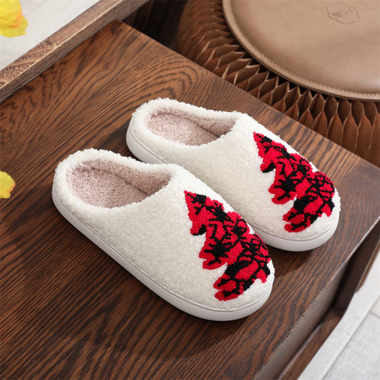 Red Christmas tree cotton slippers in plush fabric, front view of open‑mouth slip‑ons with padded interior and PVC sole for cosy indoor wear