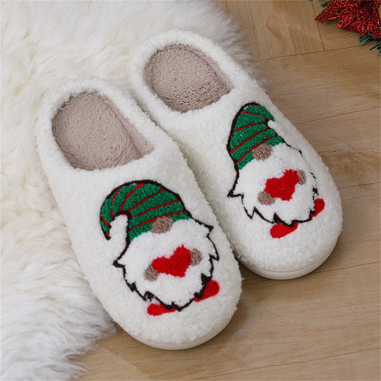 Lifestyle image of wearing faceless gnome slippers indoors, cosy festive scene – ideal Christmas gift plush home cotton slippers