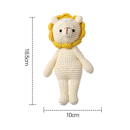 Detail of natural wooden ring and neat crochet join on handmade baby rattle – eco-friendly, tactile sensory toy