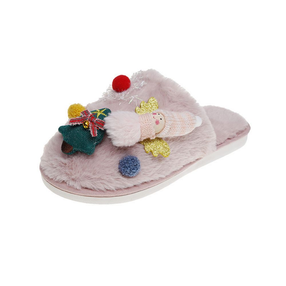 Model wearing Christmas Tree Angel plush slippers - easy on slip-ons with soft, skin-friendly plush and cosy padded support for winter mornings
