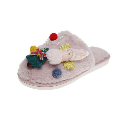 Model wearing Christmas Tree Angel plush slippers - easy on slip-ons with soft, skin-friendly plush and cosy padded support for winter mornings