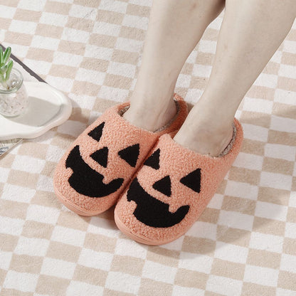 Close‑up of plush cotton‑style texture and durable TPR material on Halloween Pumpkin Slippers showing cosy lining and detailed pumpkin face