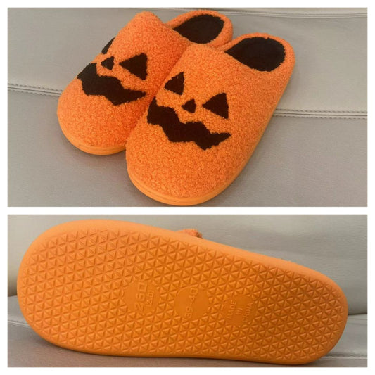 Pair of Halloween pumpkin slippers – plush, cotton-feel novelty shoes in bright orange; cosy unisex house slippers (EU sizes 37–44)