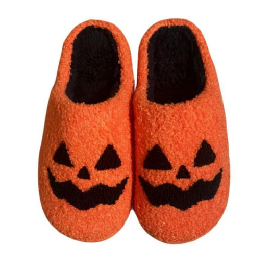 Pair of Halloween pumpkin slippers – plush, cotton-feel novelty shoes in bright orange; cosy unisex house slippers (EU sizes 37–44)