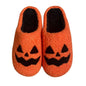 Pair of Halloween pumpkin slippers – plush, cotton-feel novelty shoes in bright orange; cosy unisex house slippers (EU sizes 37–44)
