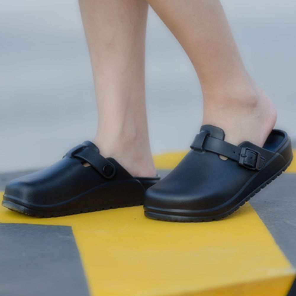 Pair of EVA nurse and laboratory clogs demonstrating protective closed-toe design and stable support — comfortable everyday footwear for healthcare and gardening