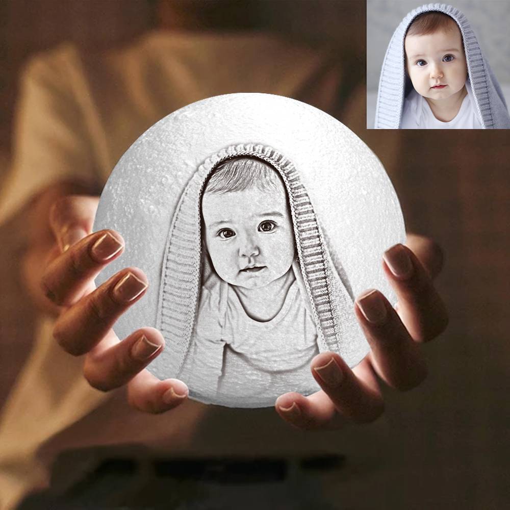 Photo moon lamp illuminated in warm white showing adjustable brightness and mild LED glow, ideal as a custom lunar light for nursery or bedroom
