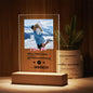 Close-up of personalised scannable music plaque on white LED base showing engraved song title and artist
