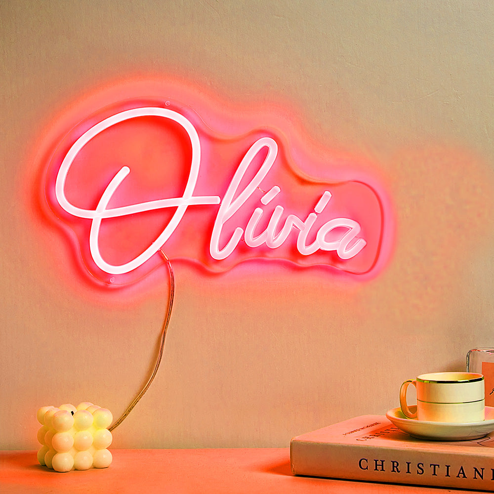 Custom personalised neon name lamp mounted above a bed creating warm ambient lighting — LED neon sign for bedroom décor