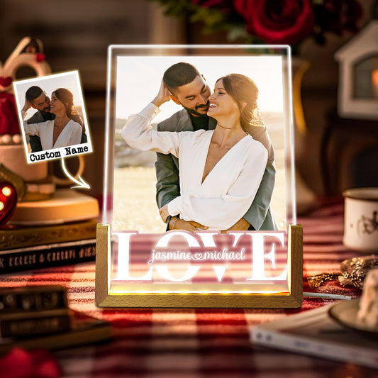 Personalised photo night light with laser‑engraved couple portrait on an acrylic panel and elegant wooden base, warm LED glow — custom couple anniversary lamp