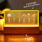 Front view of personalised birth flower night light for Grandma — LED acrylic keepsake with engraved names