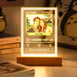 Lamp lit from within, emitting a warm glow in a stylish bedroom setting.