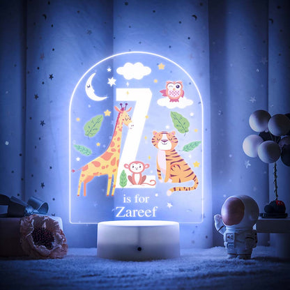 Engraved acrylic slide showing animal alphabet 'Y' design with custom name example — personalised nursery lamp