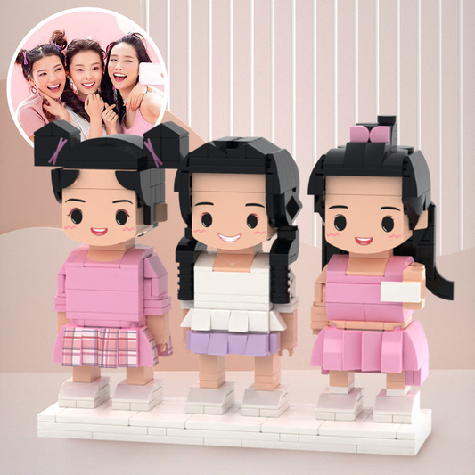 Three-person personalised brick figures on white background — bespoke Bestie custom small particle block set capturing hairstyles, outfits and expressions