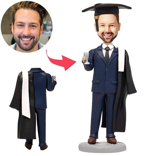 Personalised male graduate bobblehead with customised head from photo, dressed in a suit with engraved name on the base – perfect engraved graduation gift