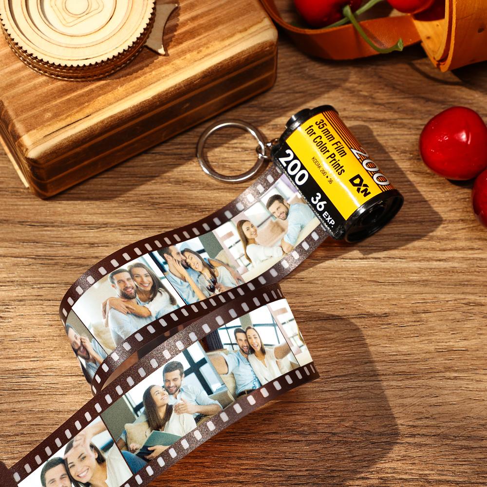 Close-up of the personalised keychain film strip with vivid photo prints and clean laser-cut edges.