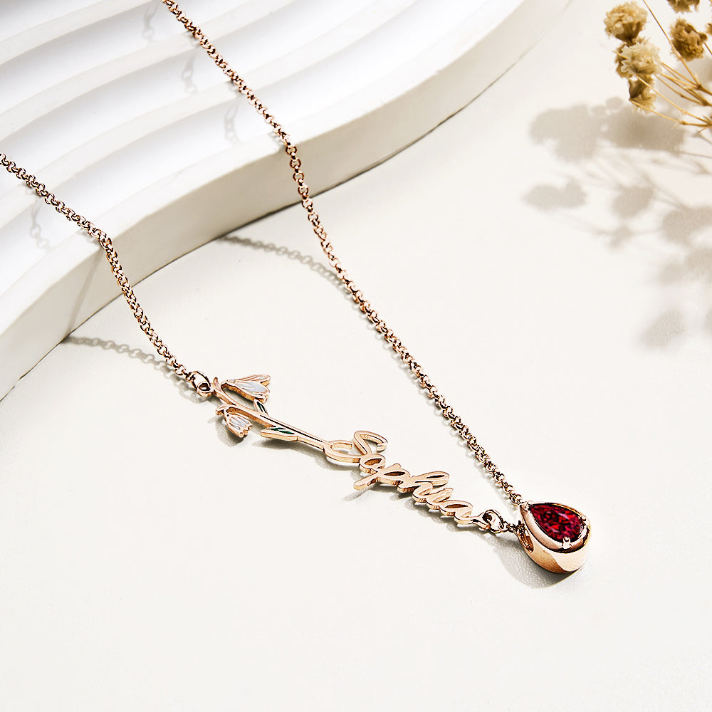 Personalised birth flower necklace with name and birthstone on a textured background showcasing durable copper jewellery finish