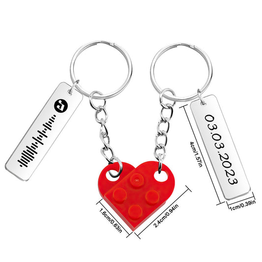 Pair of personalised heart brick keyrings with engraved music code and date‑matching design – perfect couples anniversary gift