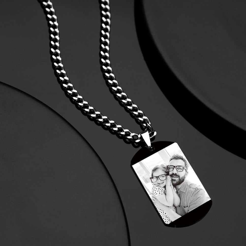 Close-up detail of black stainless steel pendant edge and thick chain, hypoallergenic engraved necklace with durable fade-resistant finish