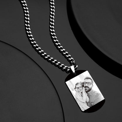Close-up detail of black stainless steel pendant edge and thick chain, hypoallergenic engraved necklace with durable fade-resistant finish