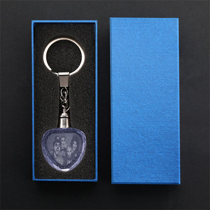 Close-up of laser-etched double-sided portrait and personalised text on clear heart crystal keyring with sturdy metal ring