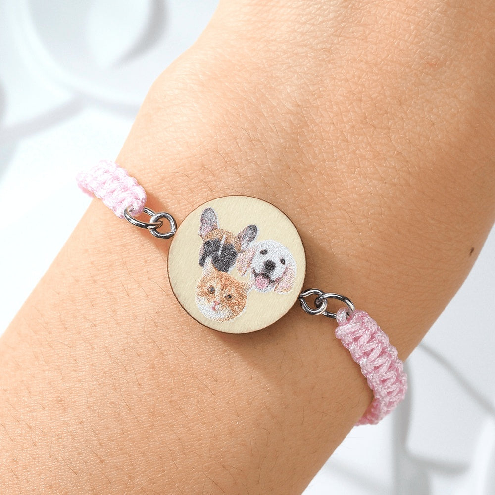 Close up of personalised pet portrait wooden pendant on an adjustable bracelet
