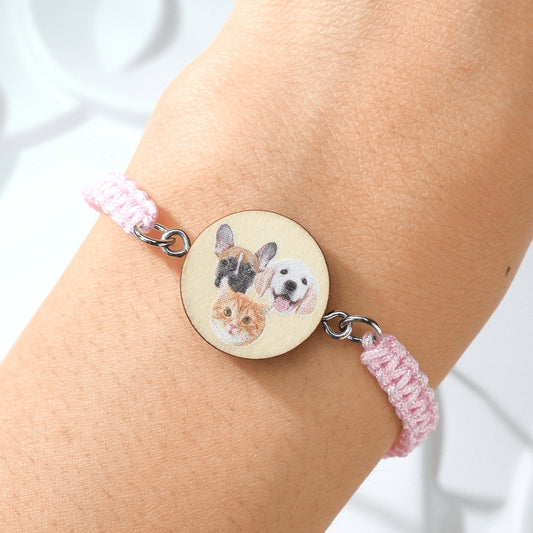 Close up of personalised pet portrait wooden pendant on an adjustable bracelet