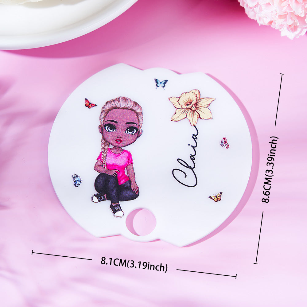 Lifestyle shot of a 40oz Stanley tumbler with personalised Cartoon Girl birth flower name tag lid topper — ideal personalised gift for her