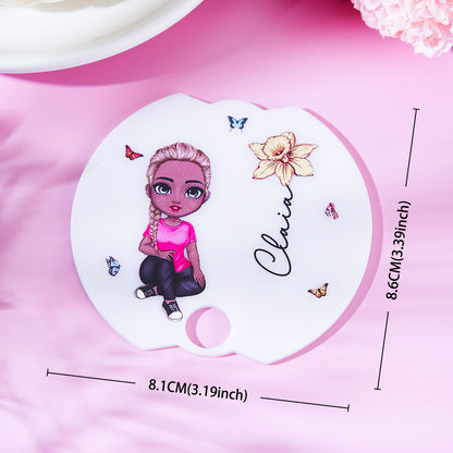 Lifestyle shot of a 40oz Stanley tumbler with personalised Cartoon Girl birth flower name tag lid topper — ideal personalised gift for her
