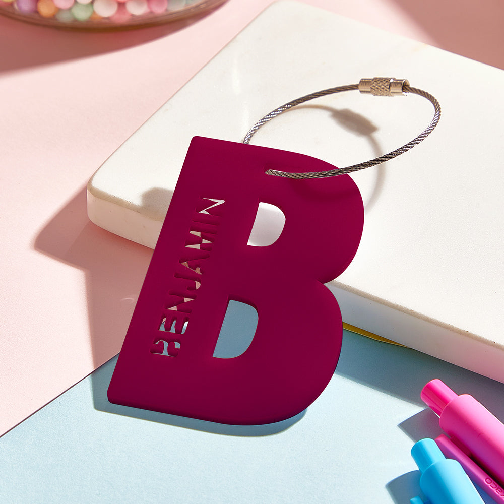 Acrylic personalised luggage tag attached to a suitcase handle, easy-to-spot luggage ID ideal for travel and school trips