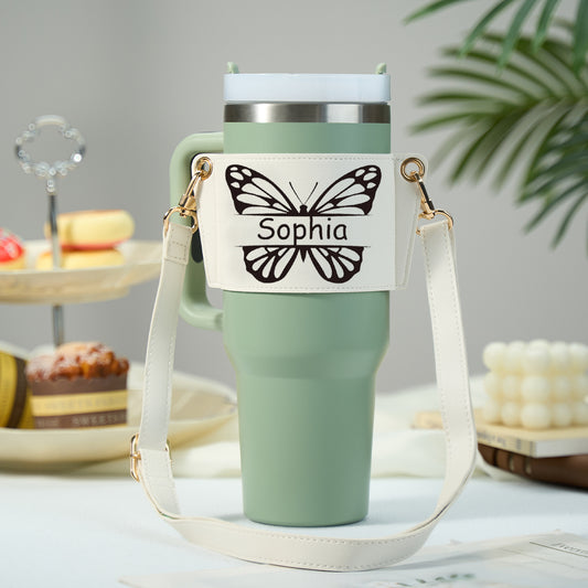 Personalised butterfly PU leather water bottle carrier bag holding a 40oz Stanley tumbler with adjustable cross‑body strap, hands‑free design