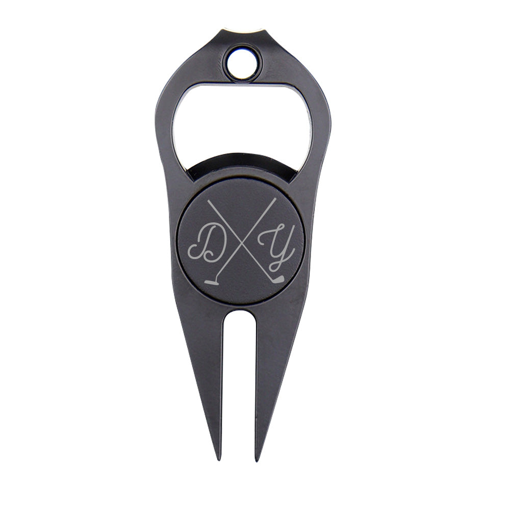 Close-up of personalised engraved magnetic ball marker and divot fork — golf accessory and bottle/can opener