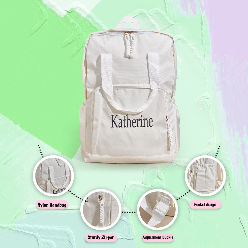 Assortment of personalised name embroidered backpacks in different colours, showcasing custom travel bag options for gifts to siblings and friends