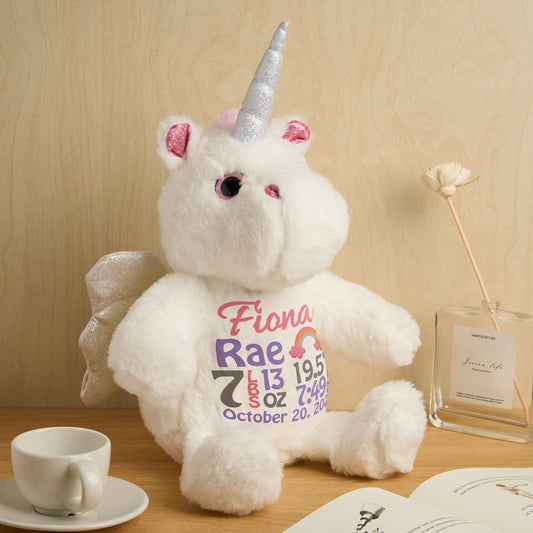 Personalised unicorn plush birth announcement teddy in pastel colours, customised with baby name and birth details, newborn keepsake