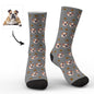 Pair of personalised photo socks laid flat showing vivid heat-transfer print and colour options — cosy custom face socks for everyday wear