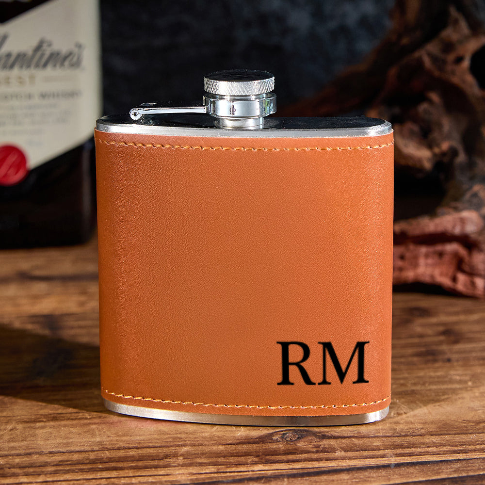 Close-up of deep laser-engraved name on PU leather-wrapped flask, showing museum-grade, fade-resistant personalised engraving