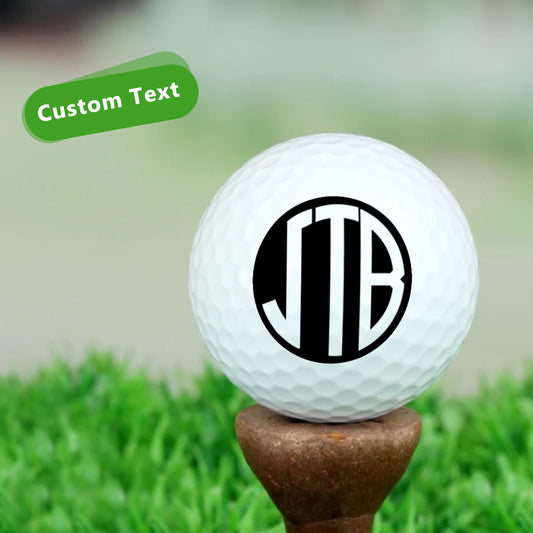 Personalised monogram golf balls in white showing custom initials, UV‑printed on durable rubber with wind‑tunnel dimples, ideal personalised golf gift for him