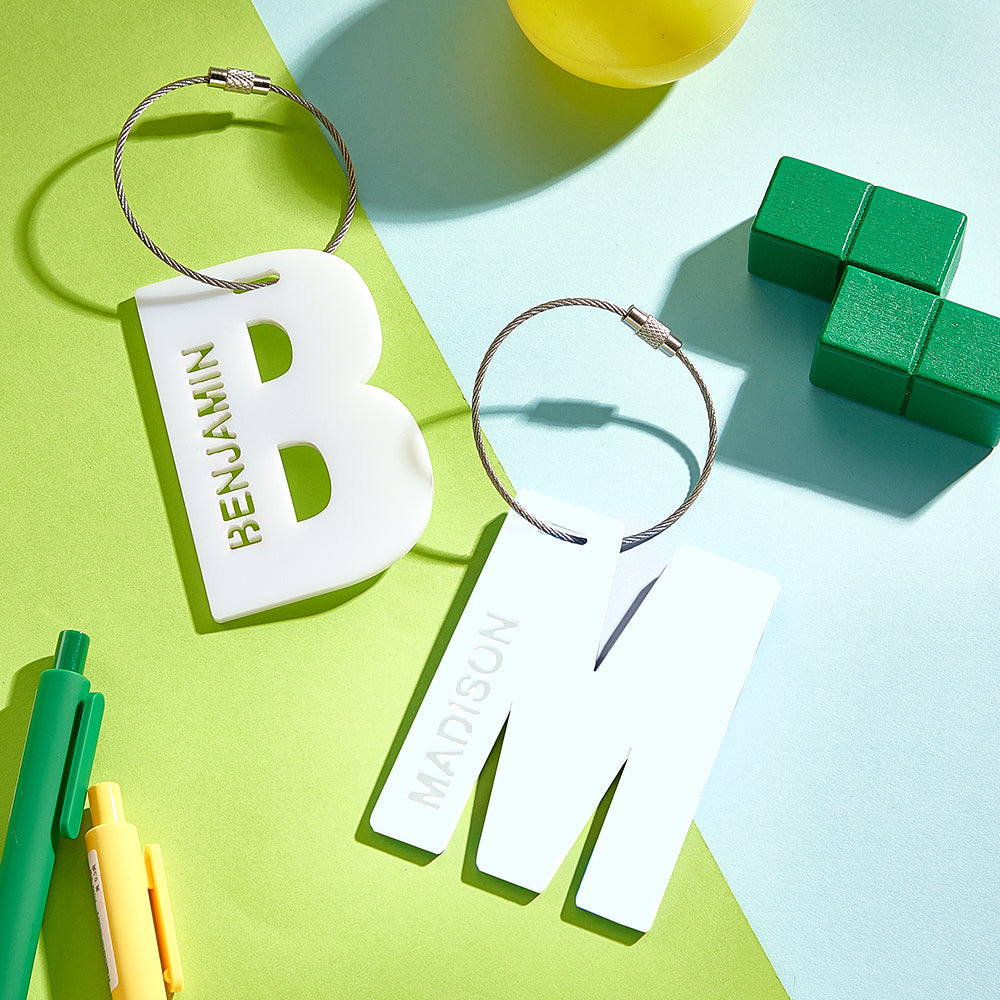 High-quality edge finish of a personalised acrylic name tag highlighting precision cut and glossy print for long-lasting use on backpacks and luggage